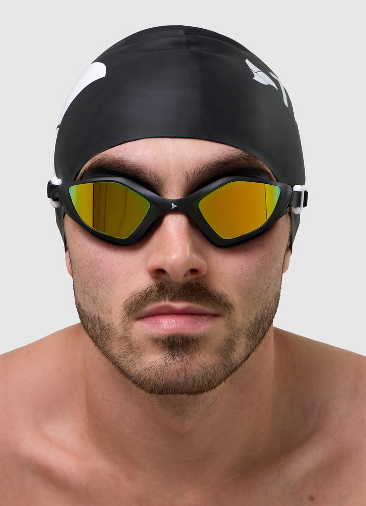 Male swimmer wearing TRI-FIT RAPID-X swim goggles in black