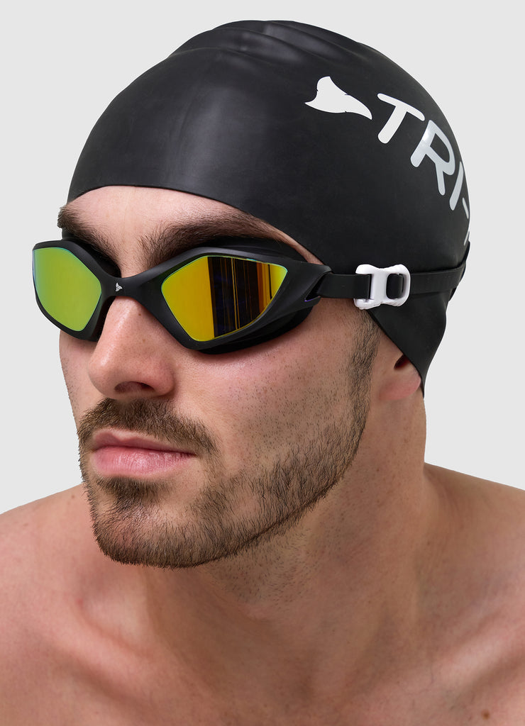 Male swimmer wearing TRI-FIT RAPID-X swim goggles in black