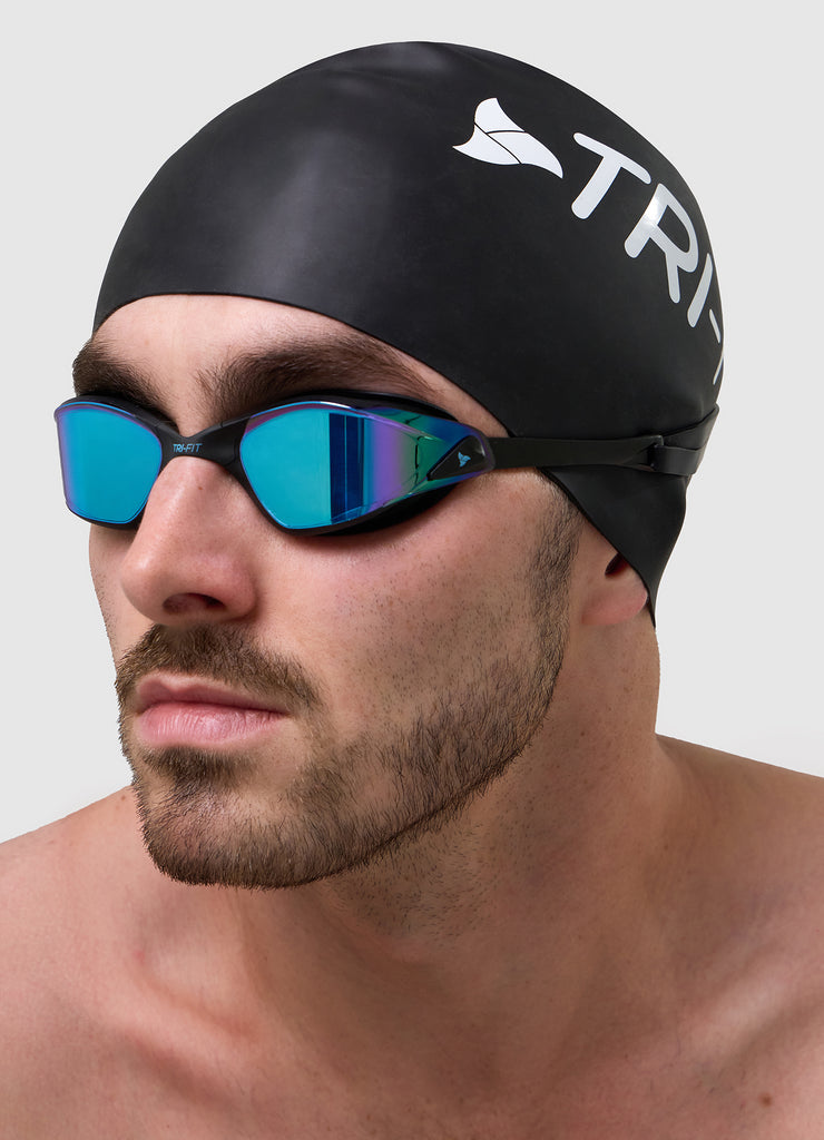 Man wearing TRI-FIT PROPEL Swim Goggles in black with blue/purple mirrored lens. Part of the award-winning TRI-FIT Goggle range.
