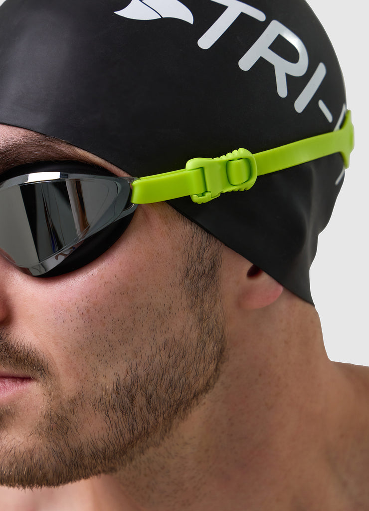 Male swimmer wearing TRI-FIT VOLT swim goggles 