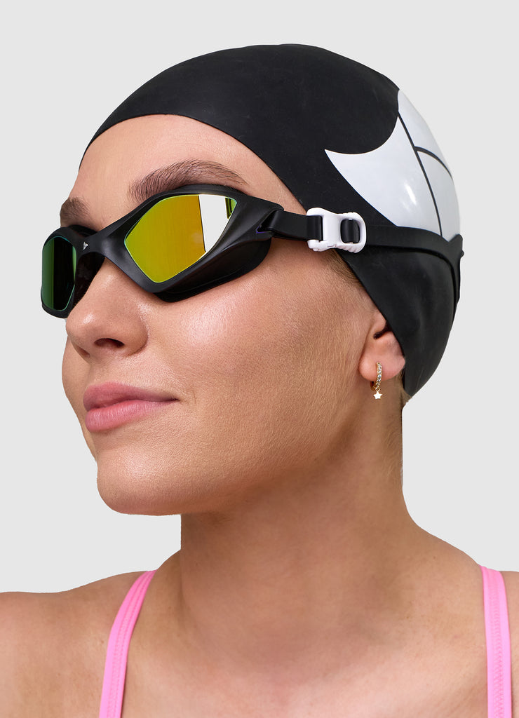 Female swimmer wearing TRI-FIT RAPID-X swim goggles in black