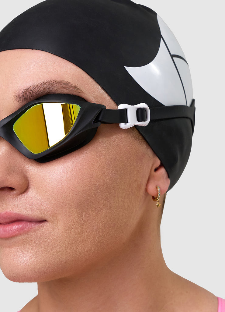 Female swimmer wearing TRI-FIT RAPID-X swim goggles in black