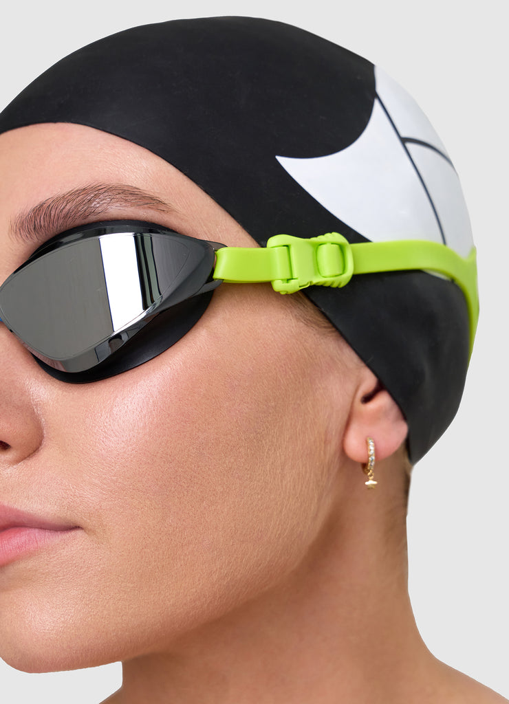 Female swimmer wearing TRI-FIT VOLT swim goggles 