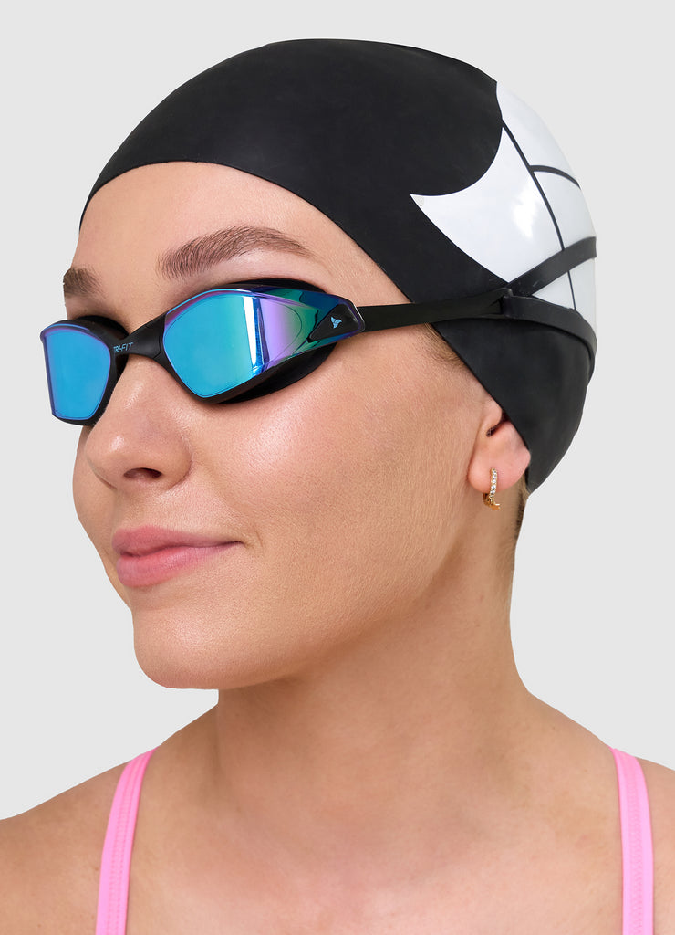 Female swimmer wearing TRI-FIT PROPEL swim goggles in white
