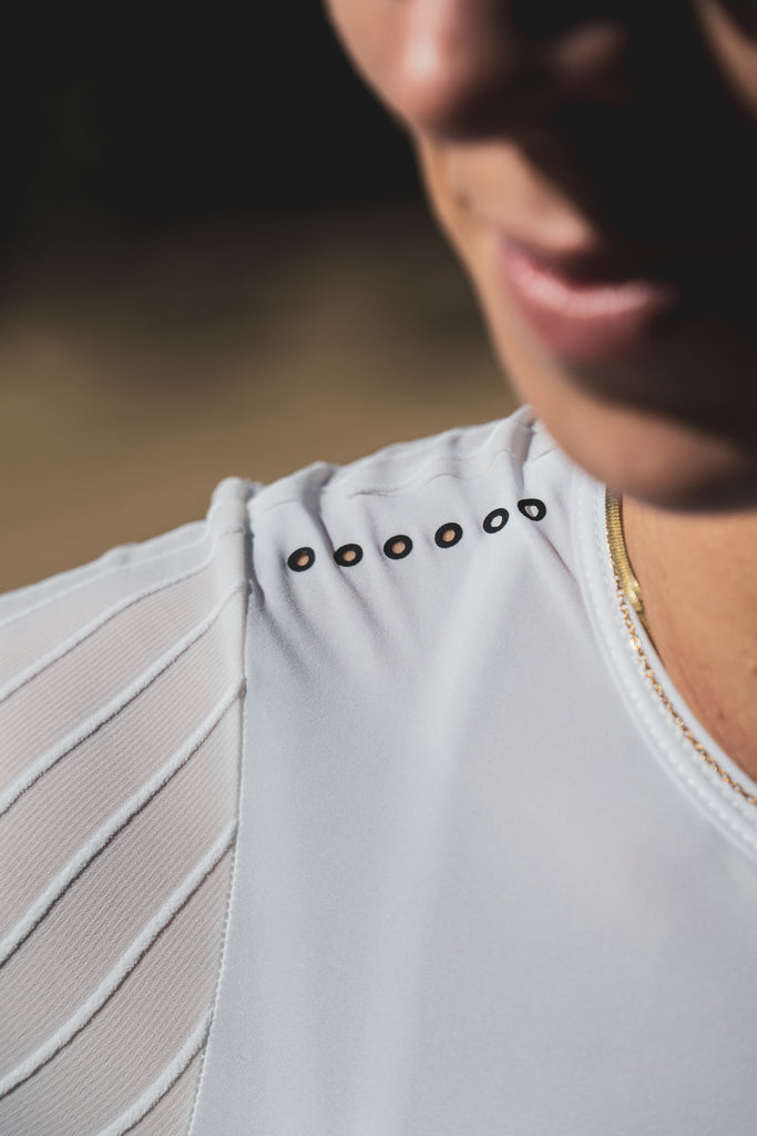 Women wearing a TRI-FIT VORTEX tri-suit. Laser cut ventilation