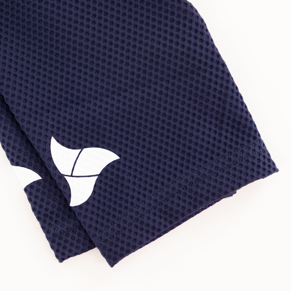 White TRI-FIT logo printed on navy mesh sleeve of VANGUARD tri-suit, with laser-cut hem