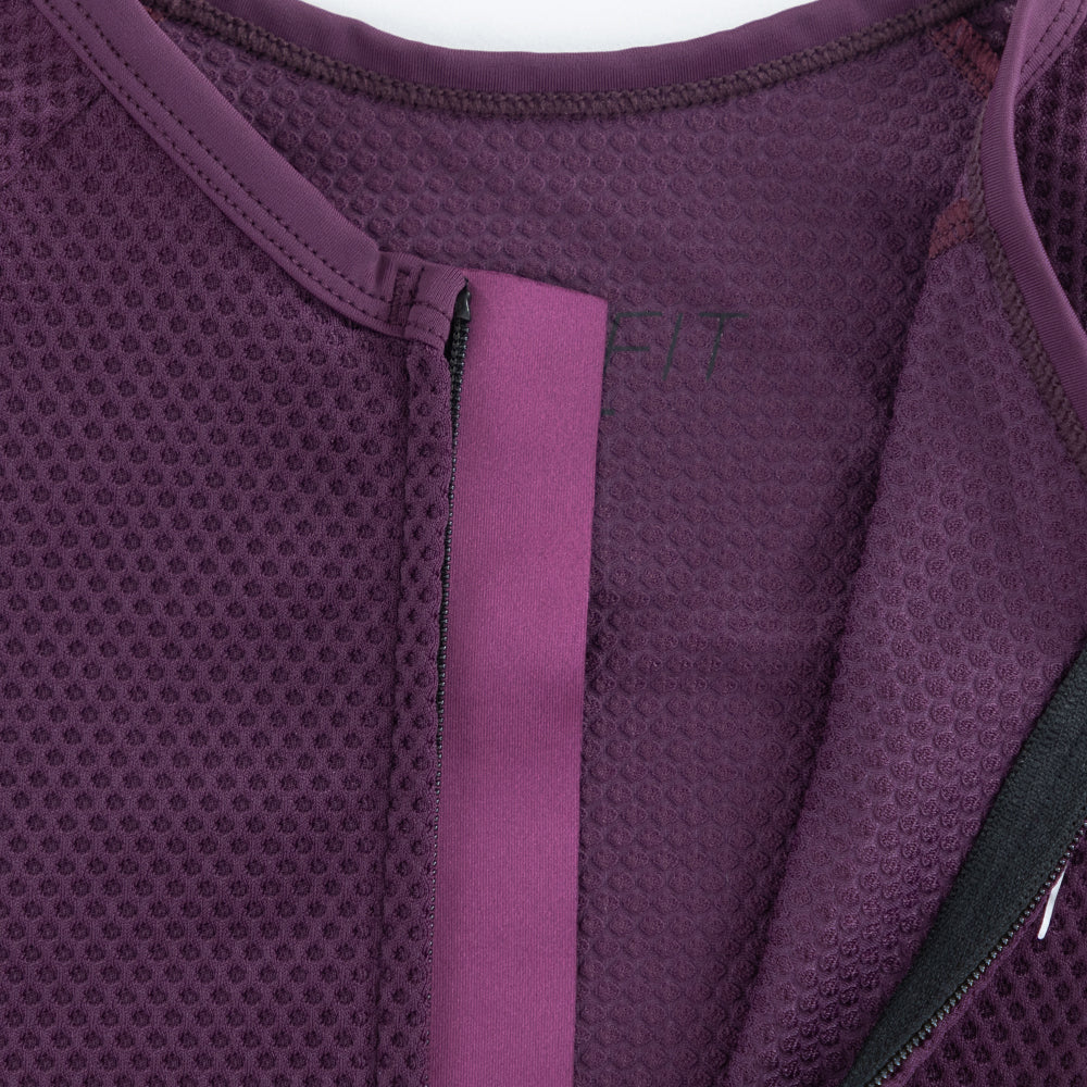 Close-up of TRI-FIT VANGUARD tri-suit neckline showing breathable mesh fabric and internal zipper construction