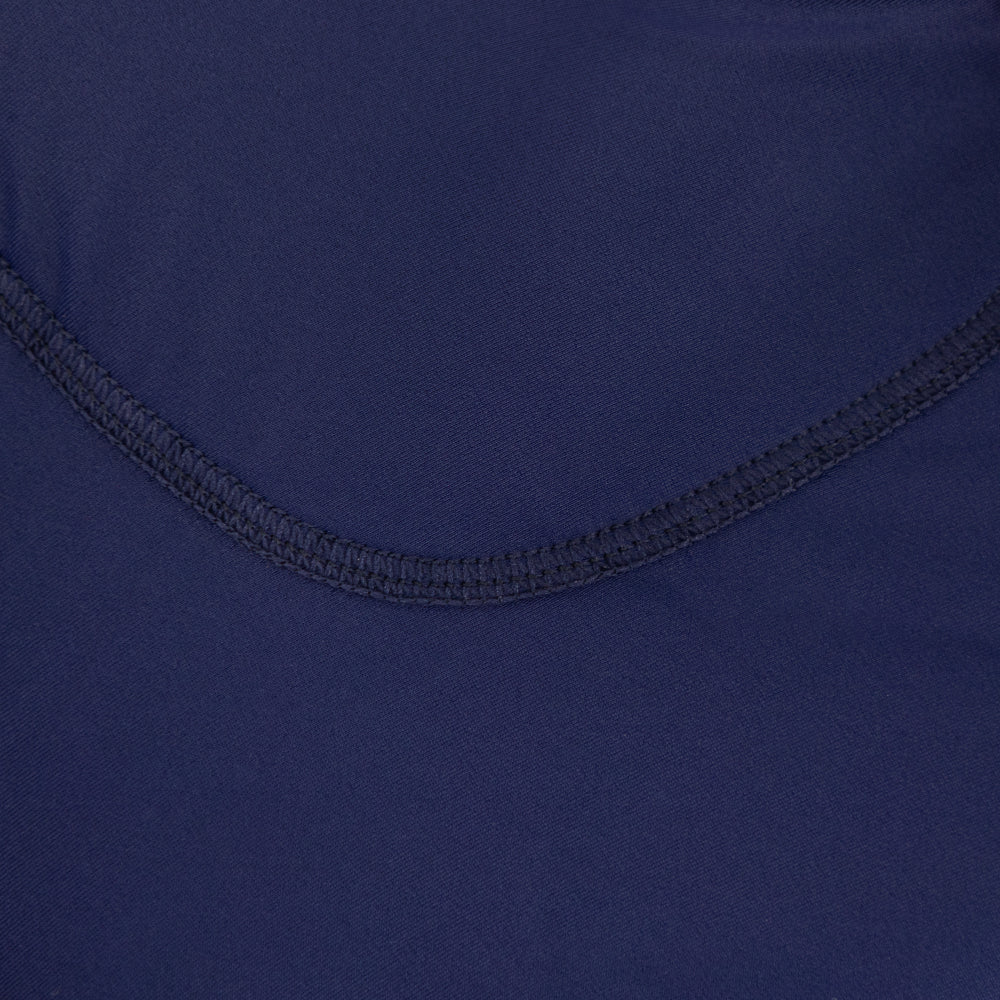 Close-up of stitching and panel construction on men’s VANGUARD tri-suit lower half in dark navy