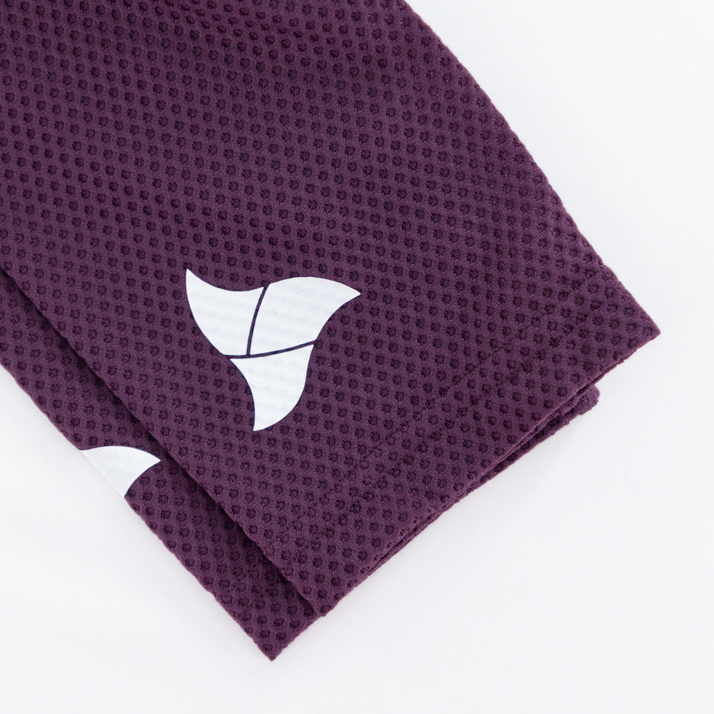 TRI-FIT logo printed on sleeve of VANGUARD tri-suit in plum, showing laser-cut finish
