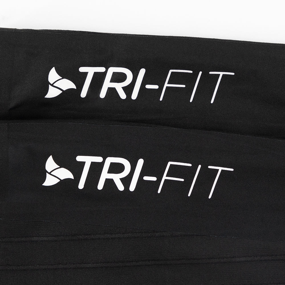 Rear logo view of VORTEX Calf Sleeves with ribbed texture designed to disrupt airflow and reduce drag.