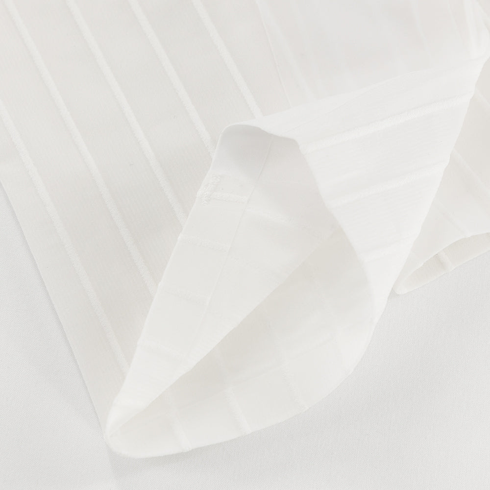 Interior hem close-up of TRI-FIT VORTEX Calf Sleeves showing bonded finish and compressive structure.