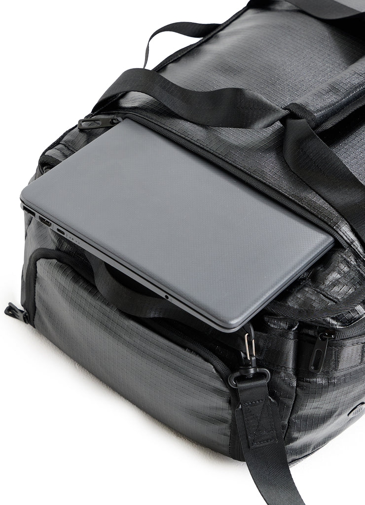 TRI-FIT 3T Bag with laptop half-inserted into the padded laptop sleeve