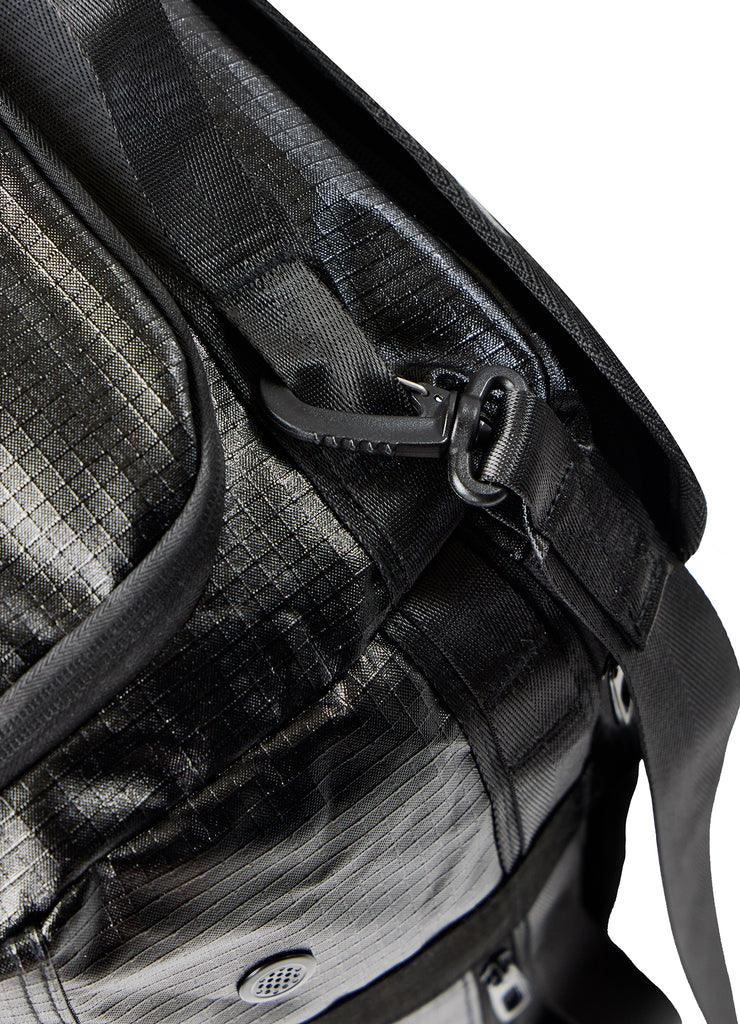 Detailed close-up of shoulder strap hook and reinforced stitching